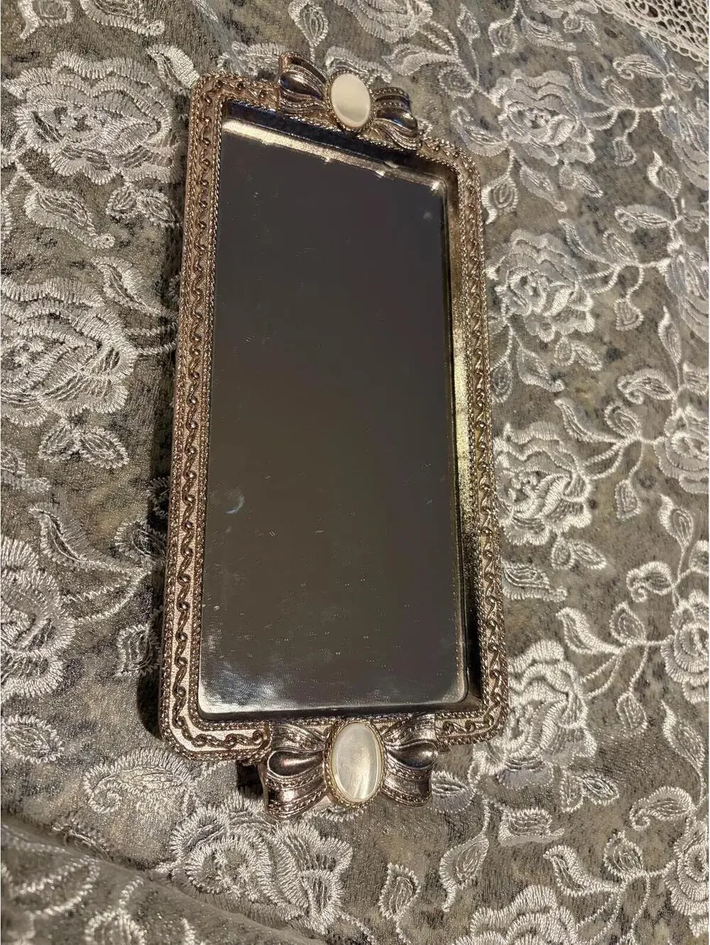 Mirrored vanity tray with mother of pearl.